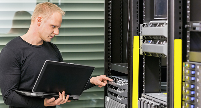 Technician working on construction industry servers