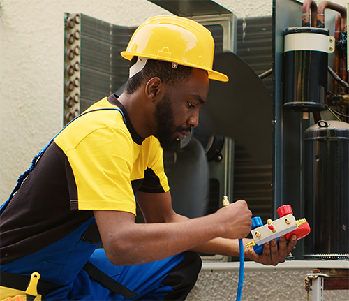 HVAC technician logging field hours for mechanical projects